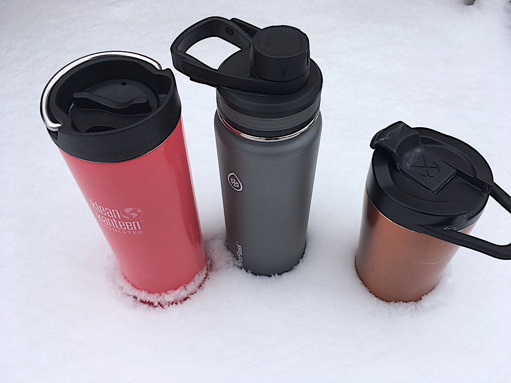 Insulated beverage thermoses in snow